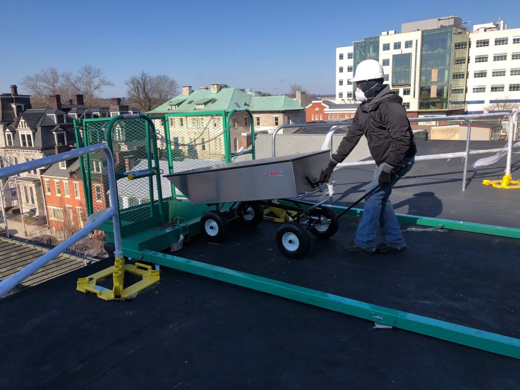 commercial roofing cart being dumped 1