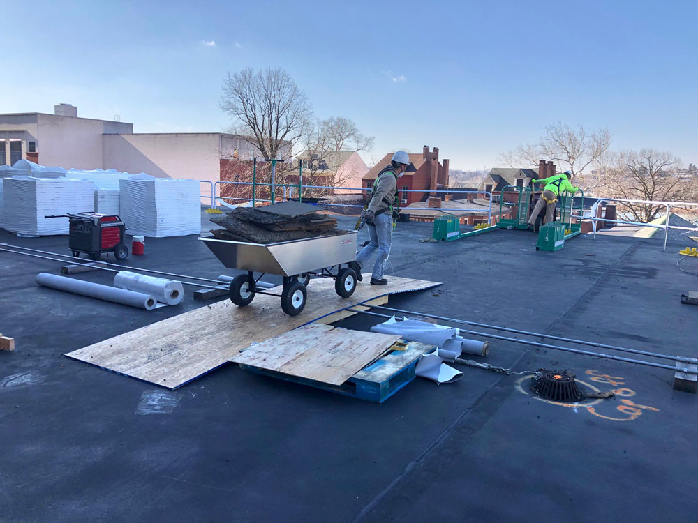 commercial roofing cart being pulled 1
