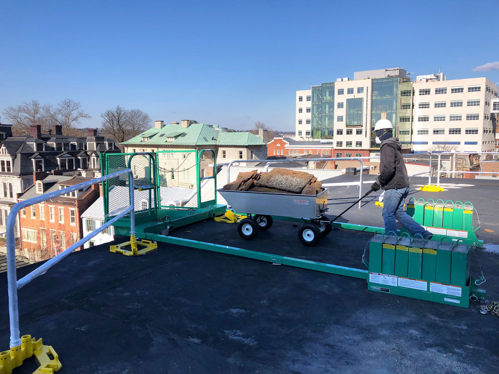 commercial roofing cart being pushed 1
